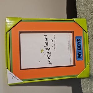 Cute colorful photo frame that reads MY BOYS on the front. NWT